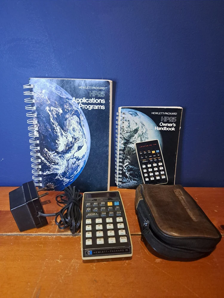 Vintage Hewlett Packard HP-25 with Instruction Manuals and Original Case